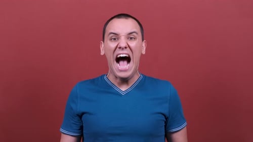 Man Shouts Out With Wide Open Mouth