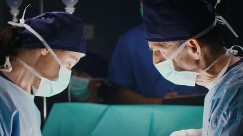 Surgeons Performing Operation in Hospital Operating Room