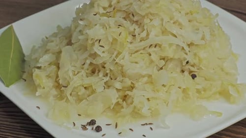 Close Up of Sauerkraut on White Plate