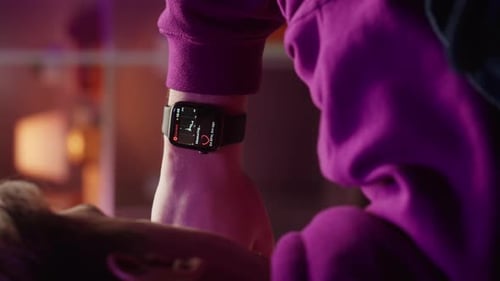 Close Up of Woman's Smartwatch Displaying Heart Rate