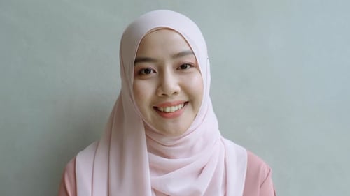 Smiling Woman Wearing Pink Hijab