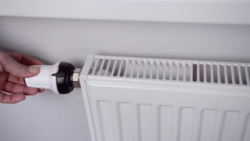Hand Adjusting Radiator Thermostat Up