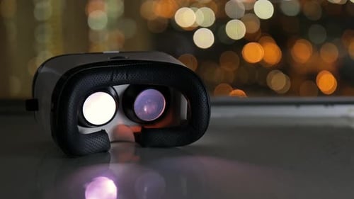 Virtual Reality Headset Over City Lights
