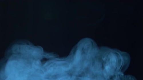 Blue Smoke Billowing on a Dark Background
