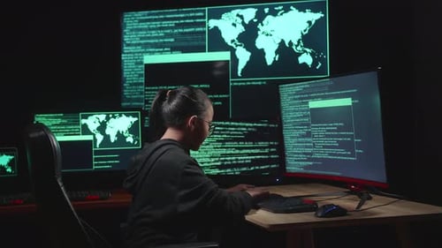 Asian Young Girl Hacker Hacking With Multiple Computer Screens In Dark Room