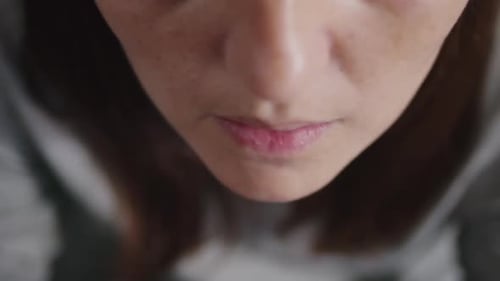 Close Up of a Woman Taking Vitamin D3 Pill and Drinking Water
