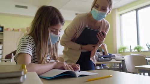 Video of school children with hands raised in classroom. Shot with RED helium camera in 8K