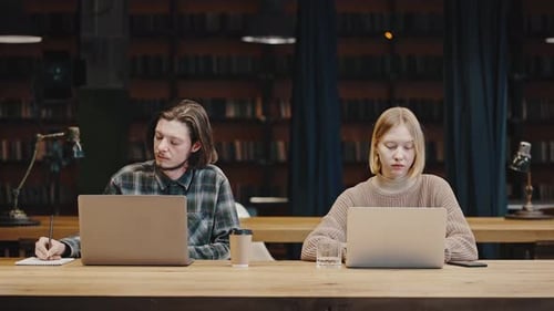 Students Working On Laptops At Large Table