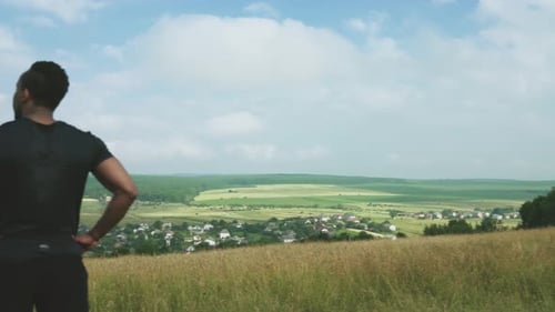 Strong Afro Man Taking a Rest Between Exercises on Nature
