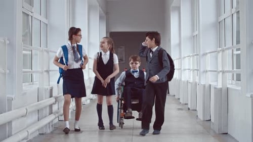 Middle School Student in Wheelchair in Hallway