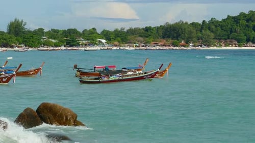 White Sandy Beach and Boats in Sea