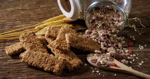 Granola Bars with Cereal and Wheat on Wood