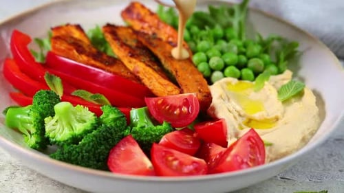 Delicious Vegetable Bowl with Hummus and Grilled Meat