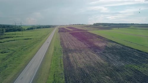 Aerial View Countryscape with Road and Distant Motorbike