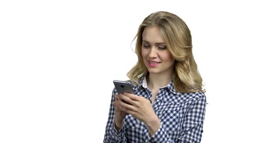 Woman Interacting with Mobile Phone in Studio Setting