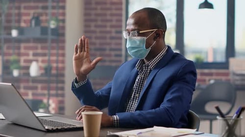 Male Employee Talking on Remote Videoconference Call
