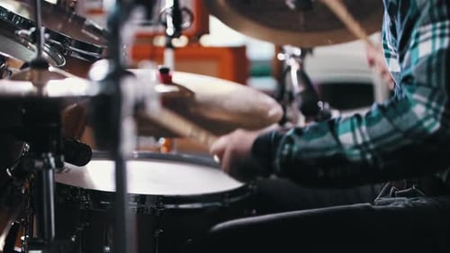 Drummer Plays Drum Set in Studio