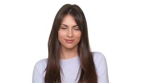 Woman Smiling and Gesturing for Silence