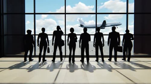 Silhouettes of Travelers at Modern Airport Terminal