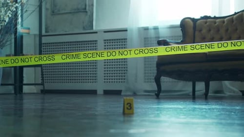 Staged Crime Scene Interior With Yellow Tape
