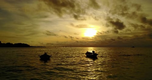 Wide drone tourism shot of a paradise sunny white sand beach and aqua blue water background in hi res