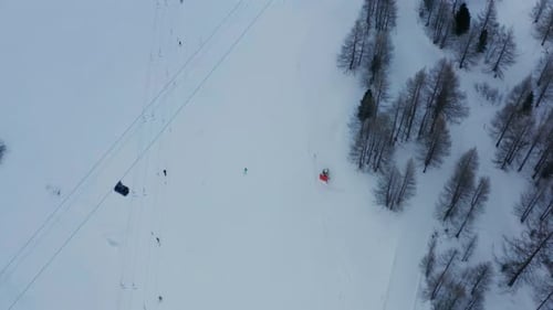 Aerial of busy skiresort, revealing the beautiful snow covered town of Saas-Fee in Switzerland