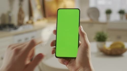 Back View of Man at Phone with Green Screen for Copy Space