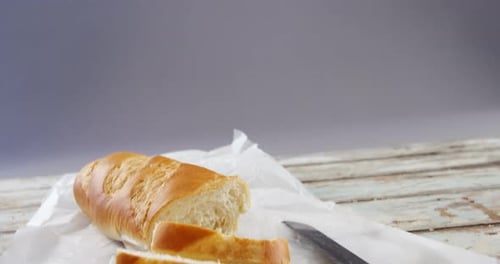 Golden Brown Baguette Bread Sliced on Table