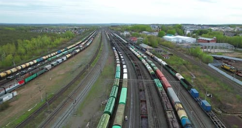 Aerial View of Many Trains on Parallel Tracks