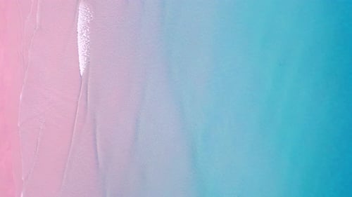 4K Aerial view top view of drone, blue sea waves and beautiful pink sand beach.