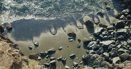 Beautiful Wild Ocean Waves Crashing on Rocky Coast Seashore Beach
