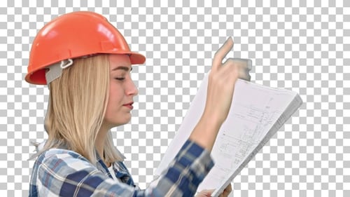 Female construction engineer reading plans, Alpha Channel