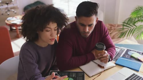 Two colleagues working in creative office