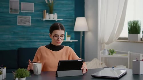 Female Student Doing Remote Class Work on Digital Tablet