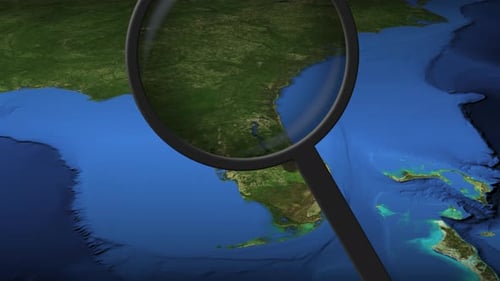 Magnifying Glass Zooming In on World Map with Location Pin Reveal