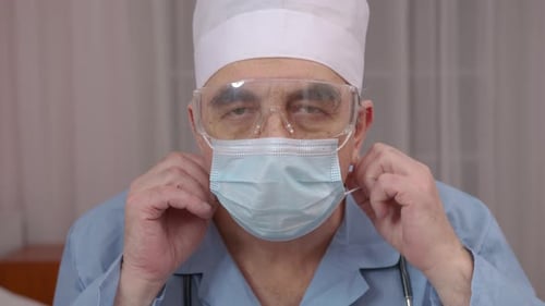 Extreme Close Up Portrait of Doctor Wearing Protective Medical Mask