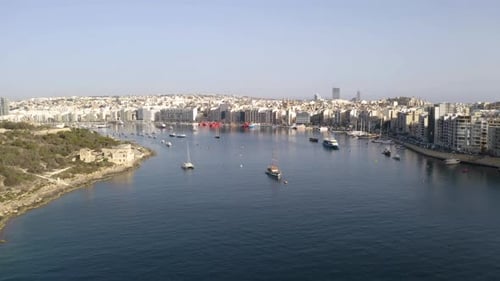 Bay harbor port of Valletta,Malta,with ships and city centre,aerial.