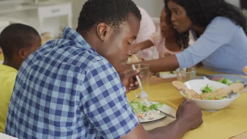 Family and Friends Enjoying Salad Meal Together