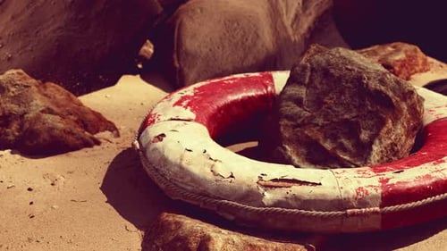 Old Life Buoy on Sandy Beach