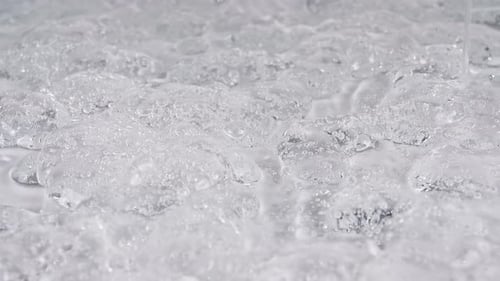 Extreme Close Up of Clear, Melting Ice Cubes