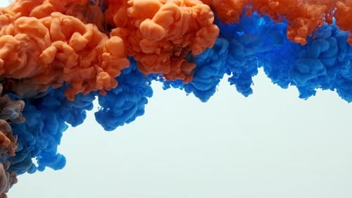 Vibrant Blue and Orange Ink Swirls in Water