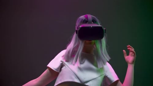 Young Adult Immersed in Virtual Reality Headset Experience