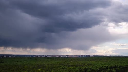 Rain dark clouds in the sky during a storm in a dramatic sky, timelapse