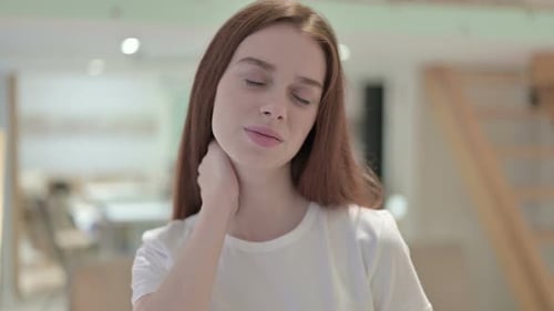 Woman Massaging Neck Due to Pain
