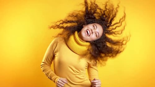 Young Cute Girl Dancing on Yellow Studio Background. Woman Colorful Bright Wear
