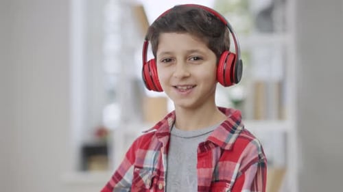 Boy With Headphones Listening to Music