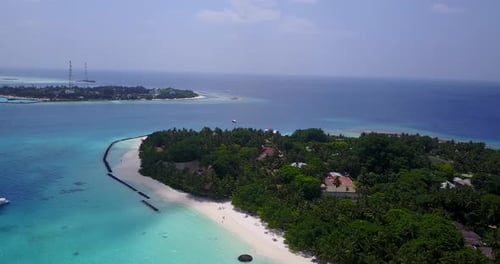 Natural above tourism shot of a white sand paradise beach and turquoise sea background