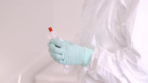 Medical Worker Preparing for Throat Swab for Coronavirus Sample