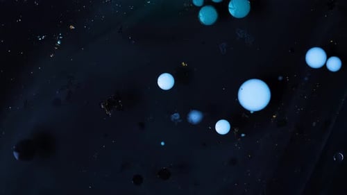 Abstract Acrylic Paint Spread Blast Explode Galaxy. Bright colored bubbles sparkling.