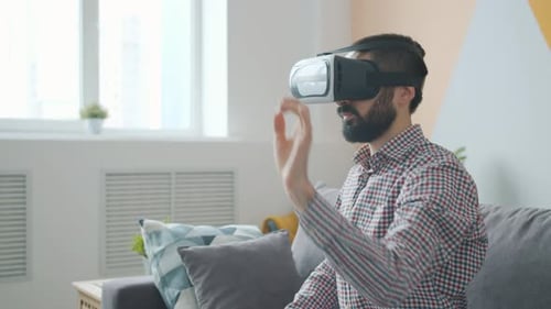 Man Wearing VR Headset Experiencing Virtual Reality